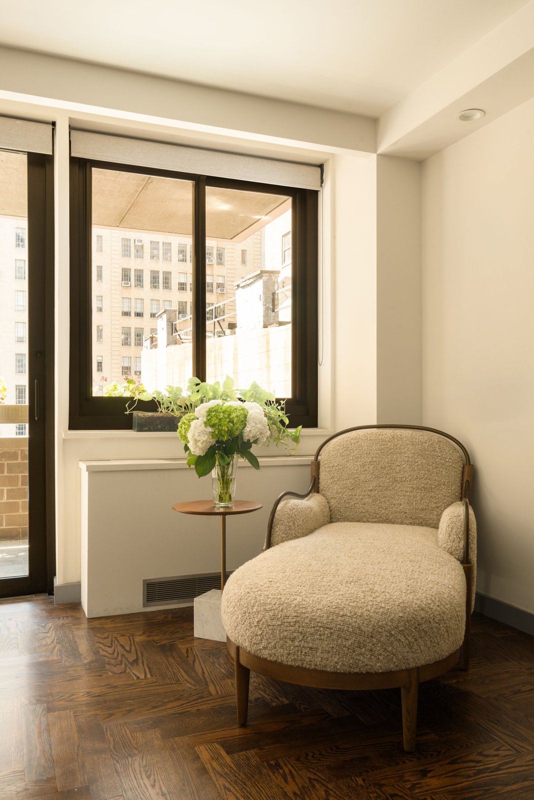 The south window and reading chair, herringbone floors below